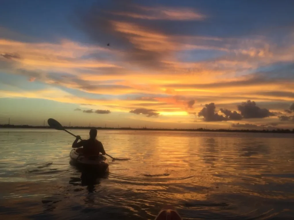Traditional handline reef fishing from a dhoni at sunset in Vaavu Atoll Maldives